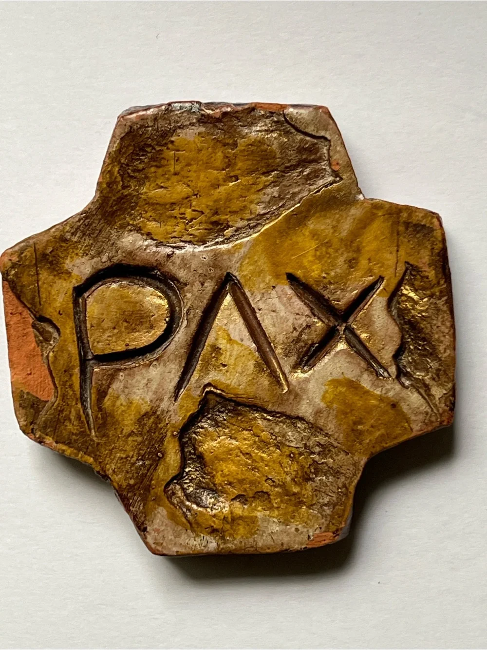 Square cross hand carved PAX( peace)  in terra-cotta with rustic stone finish
